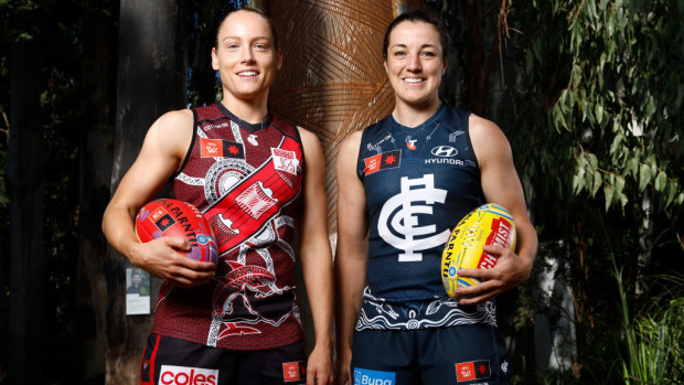 Stephanie Kane, co-captain of the Bombers, and Kerryn Peterson, captain of the Blues, pose.