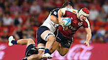 Fraser McReight of the Reds is tackled during the round six Super Rugby Pacific match.
