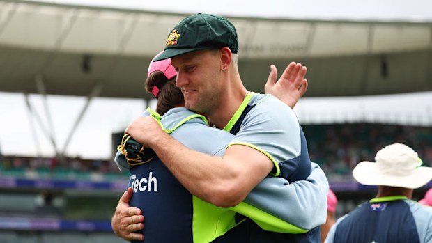 Mitchell Marsh of Australia congratulates Beau Webster of Australia after being presented with a Baggy Green.