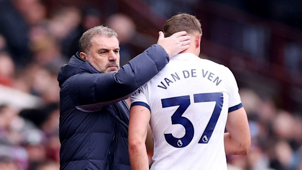 Ange Postecoglou consoles Micky van de Ven after he leaves the pitch due to injury.