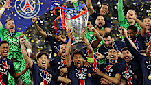 Marquinhos of Paris Saint-Germain lifts the Champions League trophy.