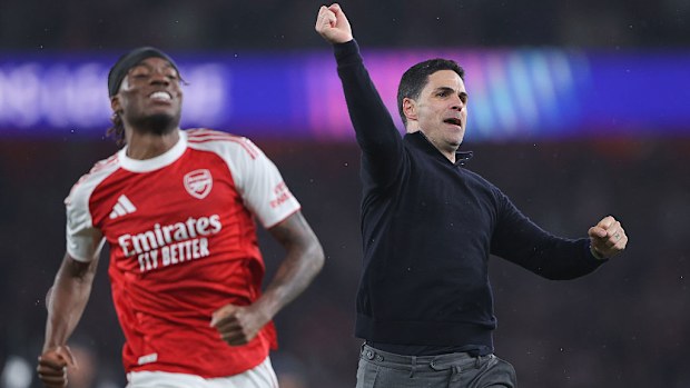 Mikel Arteta celebrates with Noni Madueke of Arsenal.