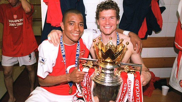 Gilberto and Jens Lehmann of Arsenal with the Premier League trophy.