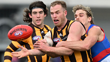 Tom Mitchell playing for Hawthorn in 2022. 