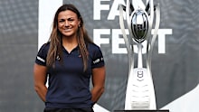 Millie Elliott of the Roosters poses alongside the NRL Womens Premiership Trophy.