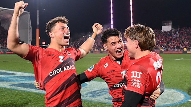 Macca Springer, Rivez Reihana and James O'Connor of the Crusaders celebrate victory.