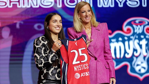 (L-R) Georgia Amoore poses for a photo with WNBA Commissioner Cathy Engelbert.