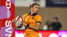 Teagan Levi of Australia scores a try against Great Britain.