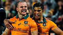 Dylan Pietsch of Australia celebrates with teammate Joseph-Aukuso Suaalii after scoring.
