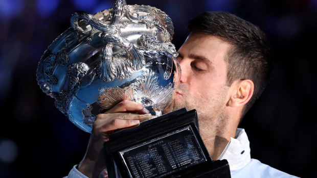 MELBOURNE, AUSTRALIA - JANUARY 29: Novak Djokovic of Serbia poses with the Norman Brookes Challenge Cup after winning the Men's Singles Final match against Stefanos Tsitsipas of Greece during day 14 of the 2023 Australian Open at Melbourne Park on January 29, 2023 in Melbourne, Australia. (Photo by Cameron Spencer/Getty Images)