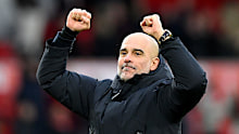 Pep Guardiola, Manager of Manchester City, celebrates with the fans.