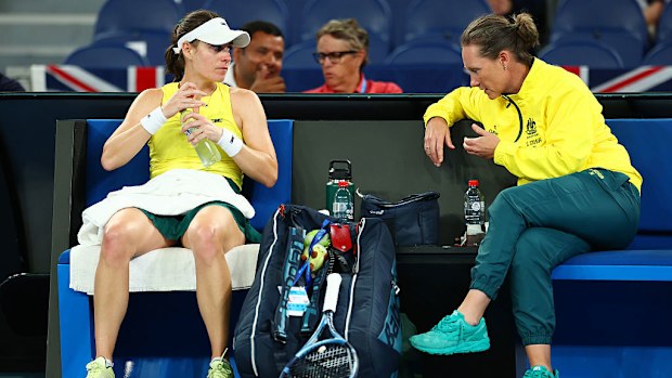 Kimberly Birrell of Australia speaks with Samantha Stosur.