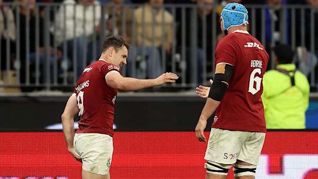 Tomos Williams of the British & Irish Lions holds his left leg after his second try.