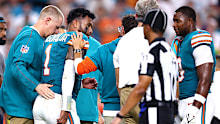 Tua Tagovailoa of the Miami Dolphins walks off the field.