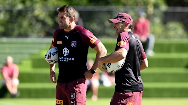 Coach Billy Slater is seen chatting with Assistant Coach Josh Hannay.