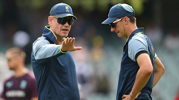 Andrew McDonald, Australia Head coach talks to Pat Cummins.