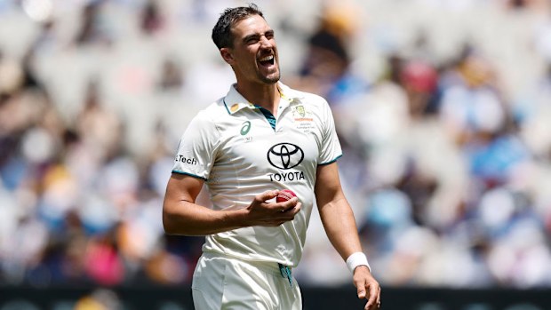 Mitchell Starc of Australia grimaces in-between deliveries.