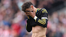 Bruno Fernandes of Manchester United  reacts after seeing his penalty shot saved.