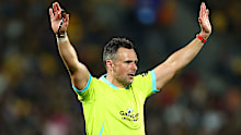 Referee James Doleman makes a call in Wellington.