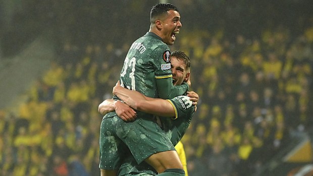 Pedro Porro and Micky van de Ven of Tottenham Hotspur celebrate.