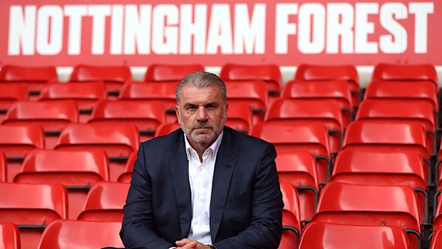Ange Postecoglou poses for a photo in the stands at City Ground.