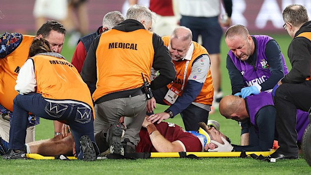 Luke Cowan-Dickie of British & Irish Lions receives medical treatment before being stretchered off the field.