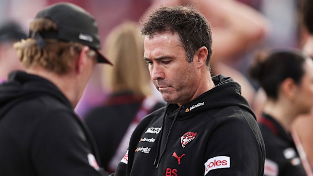 Bombers head coach Brad Scott looks on.