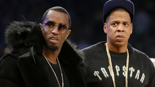 FILE - Rap moguls Sean "Diddy" Combs, left, and Jay-Z attend the NBA All-Star basketball game, Feb. 15, 2015, in New York. (AP Photo/Kathy Willens, File)