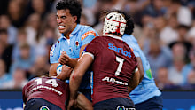 Joseph-Aukuso Suaalii of the Waratahs is tackled.