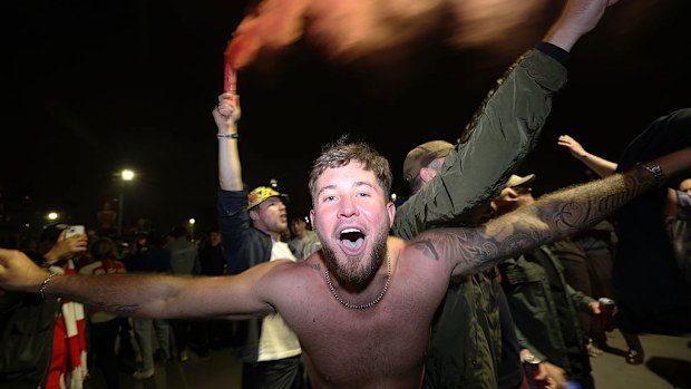Fans celebrate as Arsenal are confirmed as Premier League champions.