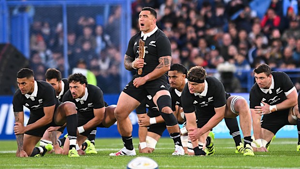 Players of New Zealand perform the haka.