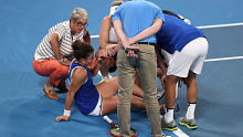 Jasmine Paolini of Team Italy recieves medical assistance.