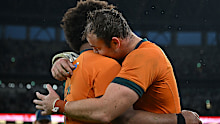Rob Valetini and Harry Wilson of Australia celebrate after the team's 19-15 victory.