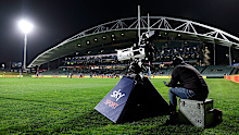 A Sky TV camera operator looks on as a power cut disables transmission.