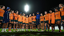 The Wallaroos huddle after their defeat.