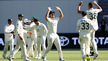 PERTH, AUSTRALIA - DECEMBER 17: Josh Hazlewood of Australia celebrates with Mitchell Marsh of Australia and team mates after taking the final wicket of Khurram Shahzad of Pakistan and winning the test by 360 runs during day four of the Men's First Test match between Australia and Pakistan at Optus Stadium on December 17, 2023 in Perth, Australia (Photo by Paul Kane/Getty Images)