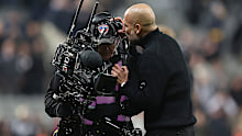 Pep Guardiola complains to a TV cameraman after the Premier League match.