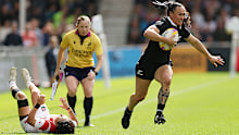 Portia Woodman-Wickliffe of New Zealand runs with the ball before scoring.