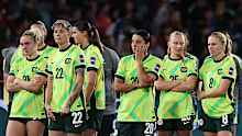 The Matildas look dejected after losing.