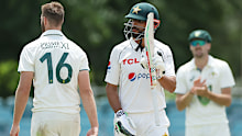 CANBERRA, AUSTRALIA - DECEMBER 07:   Shan Masood of Pakistan celebrates and acknowledges the crowd after scoring a double century during day two of the Tour Match between PMs XI and Pakistan at Manuka Oval on December 07, 2023 in Canberra, Australia. (Photo by Mark Metcalfe/Getty Images)