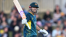 HOBART, AUSTRALIA - FEBRUARY 09: David Warner of Australia celebrates scoring a half century during game one of the Men's T20 International series between Australia and West Indies at Blundstone Arena on February 9, 2024 in Hobart, Australia. (Photo by Steve Bell/Getty Images)