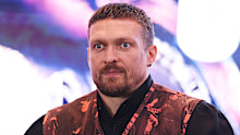 Oleksandr Usyk looks on during a press conference.