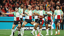 Rob Leota of the First Nations & Pasifika celebrates after scoring a try.