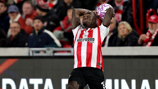 Michael Kayode of Brentford takes a long throw.