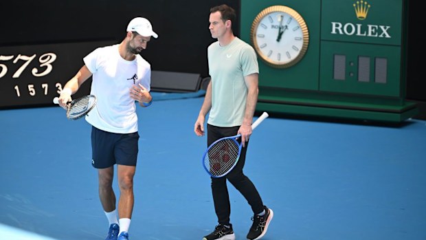 Novak Djokovic of Serbia with coach Andy Murray during a practice session.