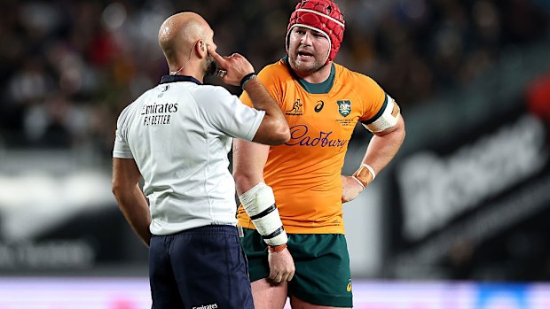 Referee Andrea Piardi talks with Harry Wilson of Australia.