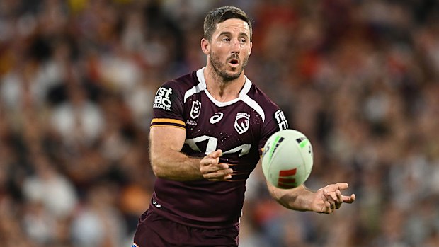 Ben Hunt of the Broncos passes the ball.