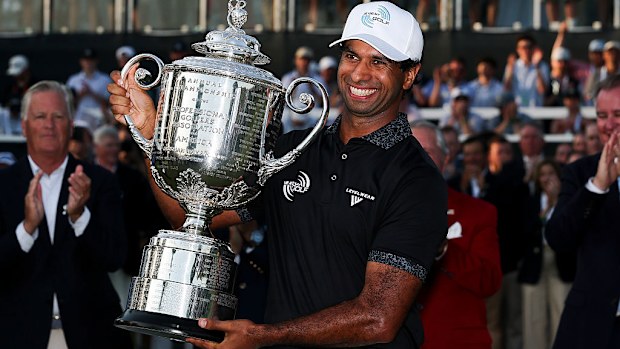 Aaron Rai of England celebrates with The Wanamaker Trophy.