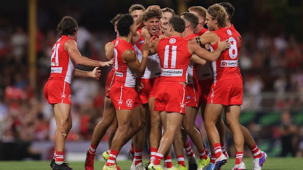 Charlie Curnow celebrates kicking his first goal for the Swans.