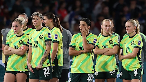 The Matildas look dejected after losing.